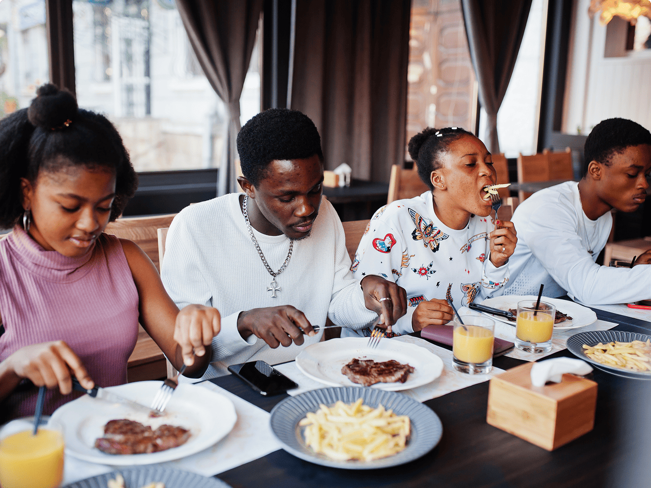 Happy friends sharing a meal